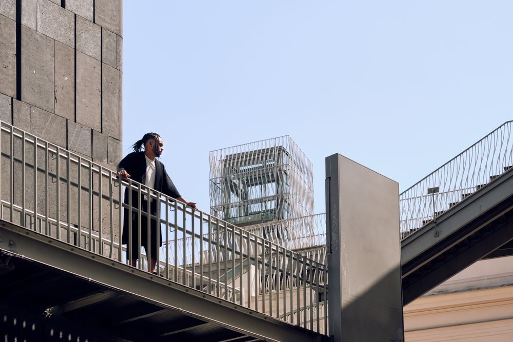 Black male standing on bridge