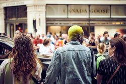 London, England, United Kingdom - July 7th, 2019: Man with brightly dyed hair at parade