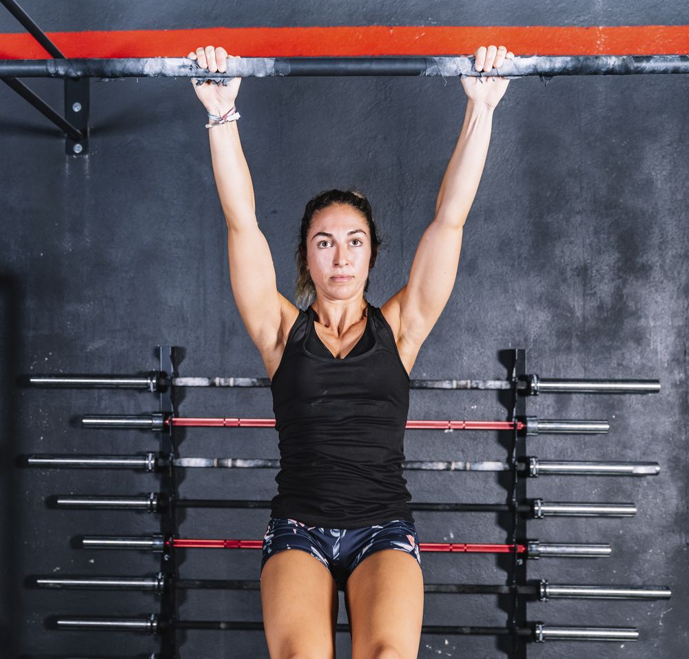 Hardworking female training in gym