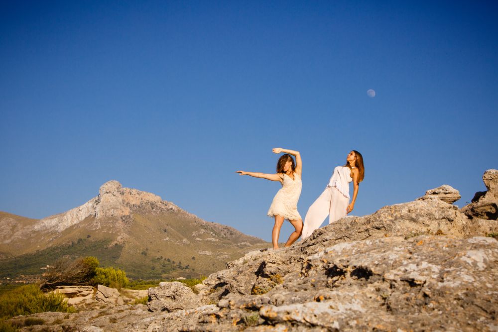 Young women posing on stones