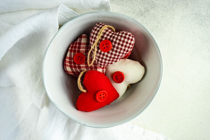 St. Valentines Day concept with top view of bowl of heart decorations