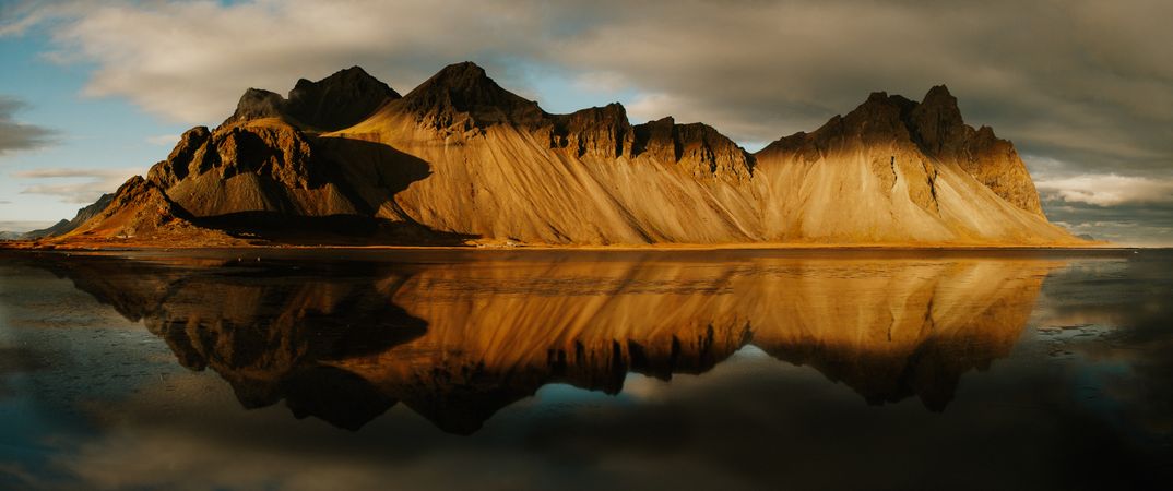 Panorama of grand cliff above water