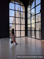 Woman holding purse looking at window in Museo del Novecento In Milano, Italy 5z6XP5
