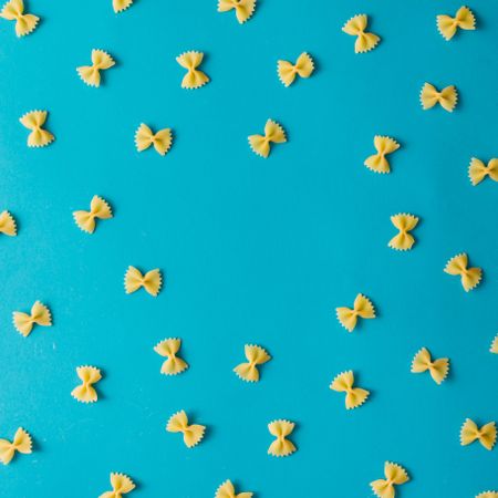 Pattern made of pasta on blue background