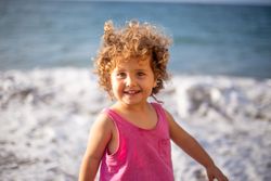 Child near sea on coast