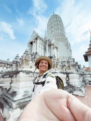 cheerful traveler captures a moment at a stupa