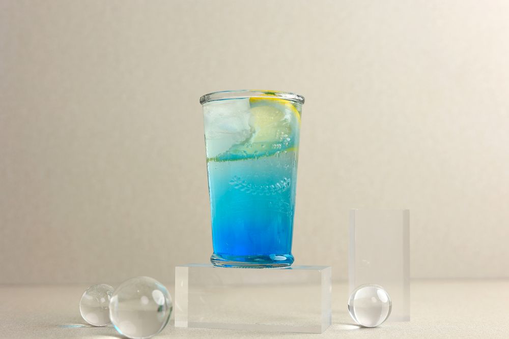 Blue Lagoon or Ocean Blue Cocktail with Sliced Lemon
