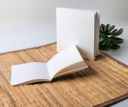 Blank books on placemat