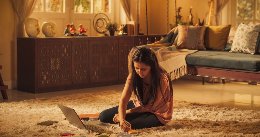 Focused Indian Woman Studying at Home: Engaged in Learning, Researching, Study Remotely for University Degree.