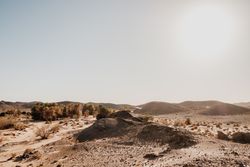Sunset sky over hills in desert
