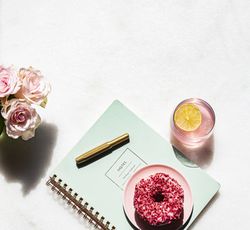 Summer office desk stationery and soda flat lay on light marble