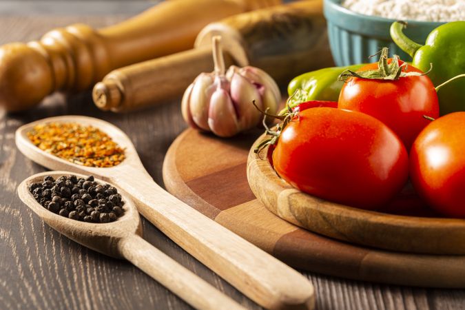 Wooden table with ingredients for pizza.