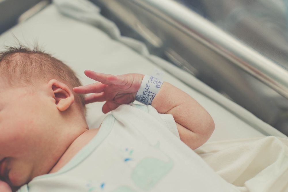 Close-up on baby in bassinet at hospital