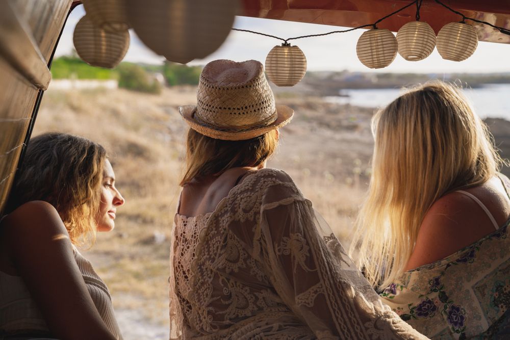 women looking at a map inside a minivan