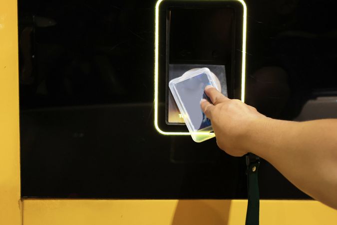 Man Hand Tapping E Toll Card as Highway Payment.