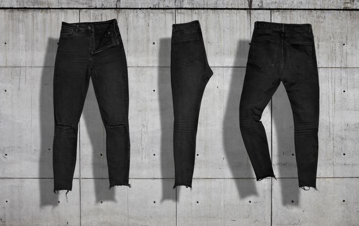 Dark jeans set on concrete