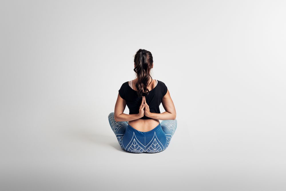 Woman stretching arms and back