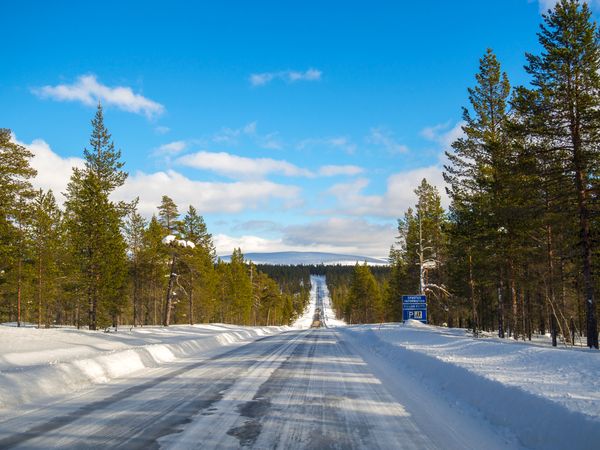 Snowy road on clear wintry day