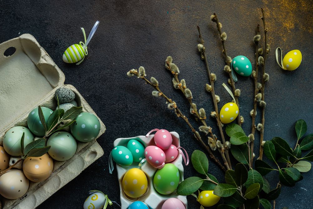 Easter holiday card concept with cartons of decorative eggs