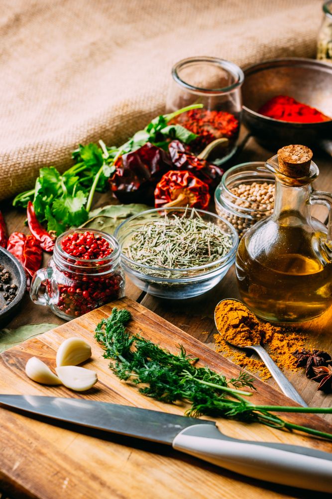 Spices and oil near knife