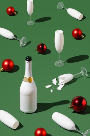 Pattern made with champagne bottle, Christmas baubles and glasses