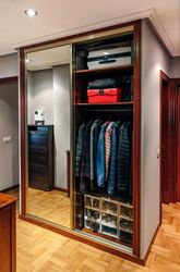Built-in wardrobe open with mirror doors