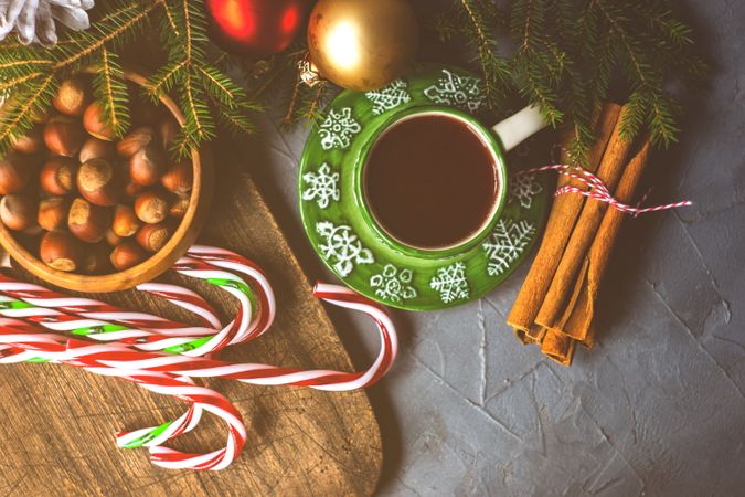 Green cup and saucer with warm drink