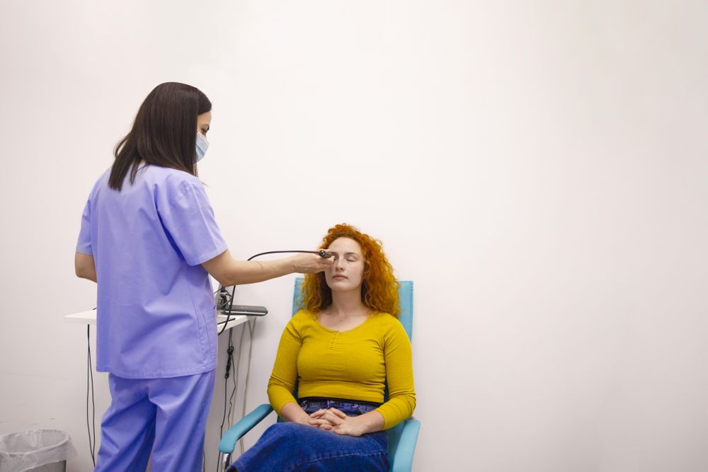 Female doctor checking patient’s eye