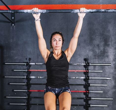 Hardworking female training in gym
