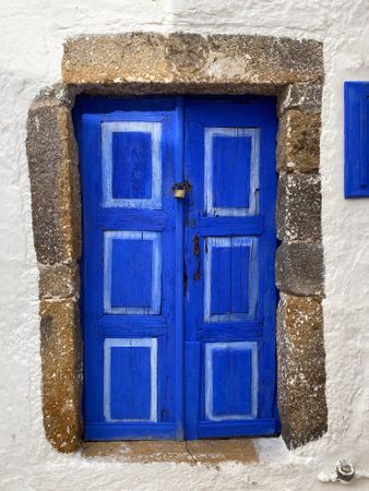 Patmian blue door with padlock