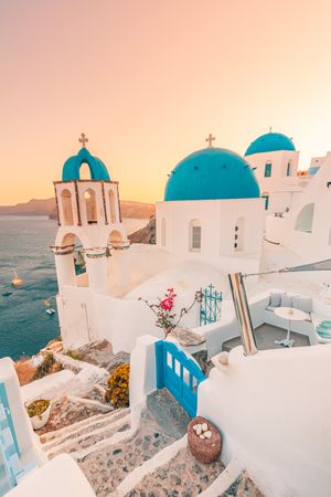 Blue domes of Santorini over the Aegean Sea, vertical