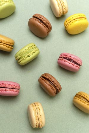 Above view of pastel macaroons on a marble background