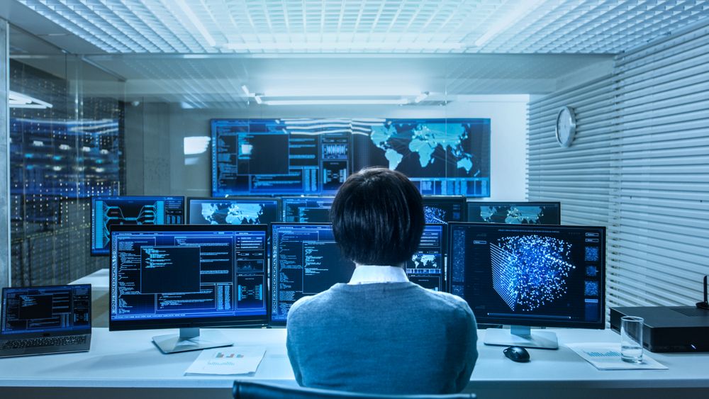 In the System Control Data Center Technician Operates Multiple Screens with Neural Network and Data Mining Activities.