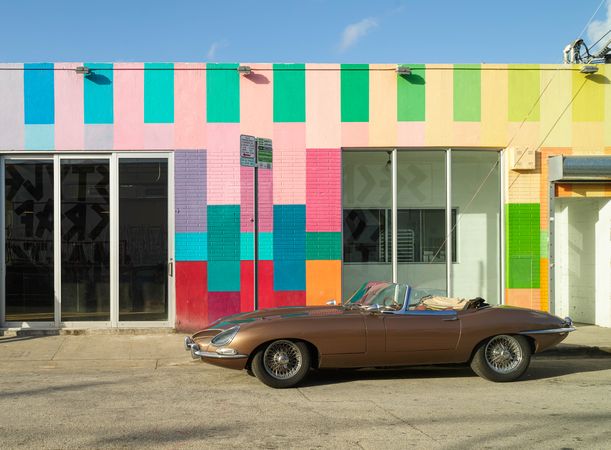 Colorful painted building and convertible in Miami