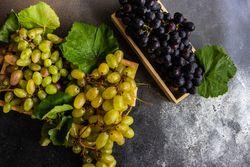 Top view of box of delicious fresh green & red grapes with space for text