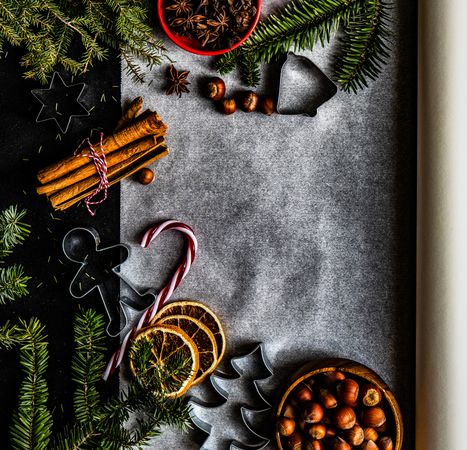Christmas holiday concept of baking sheet with spices and cookie cutter
