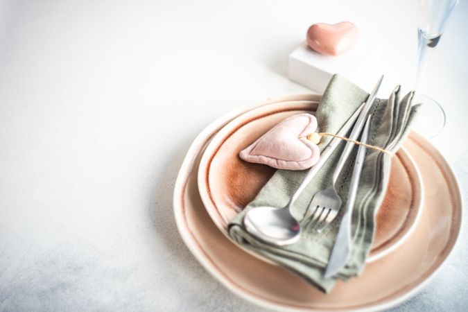 Pink table setting for Valentine's day with felt pink ornament