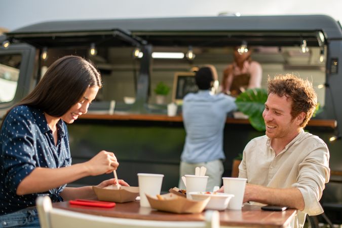 Young couple having breakfast in cafe