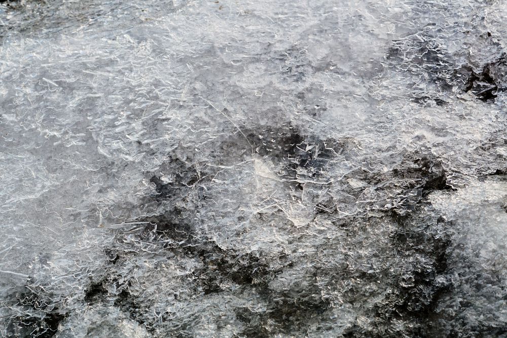 Melted snow crust over rocks