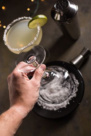 Preparing a margarita cocktail