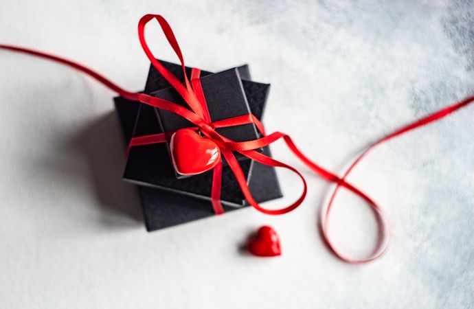 Small Valentine's presents with heart & ribbon with copy space