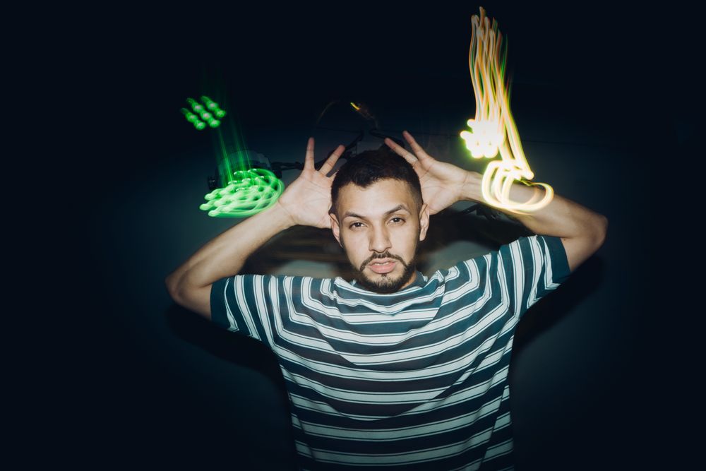 bearded man dancing in spotlight
