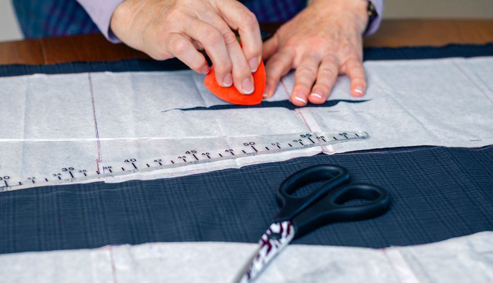 Dressmaker design tailor pattern on the table