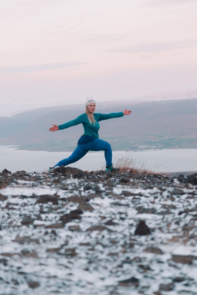 Woman posing on hill in snow