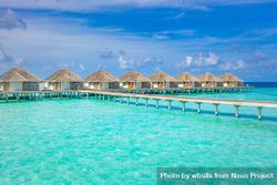 Walkway on the way to overwater bungalows in a resort, landscape 0WmOM4