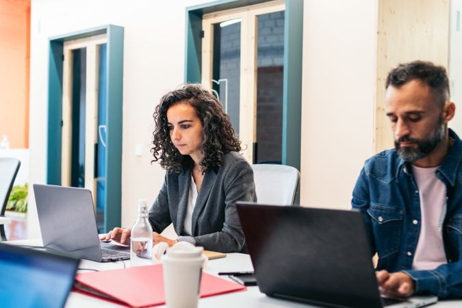 people working with laptop in a coworking