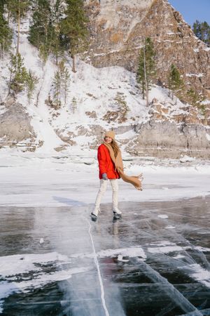 Woman skating on frozen river
