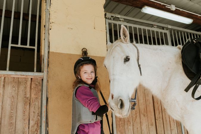 Portrait of a girl with a horse
