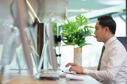 Side view of male working in office