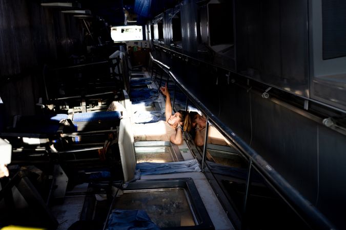 Military woman looking at ceiling of base